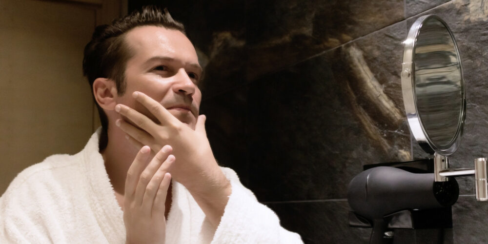 man-using-aftershave